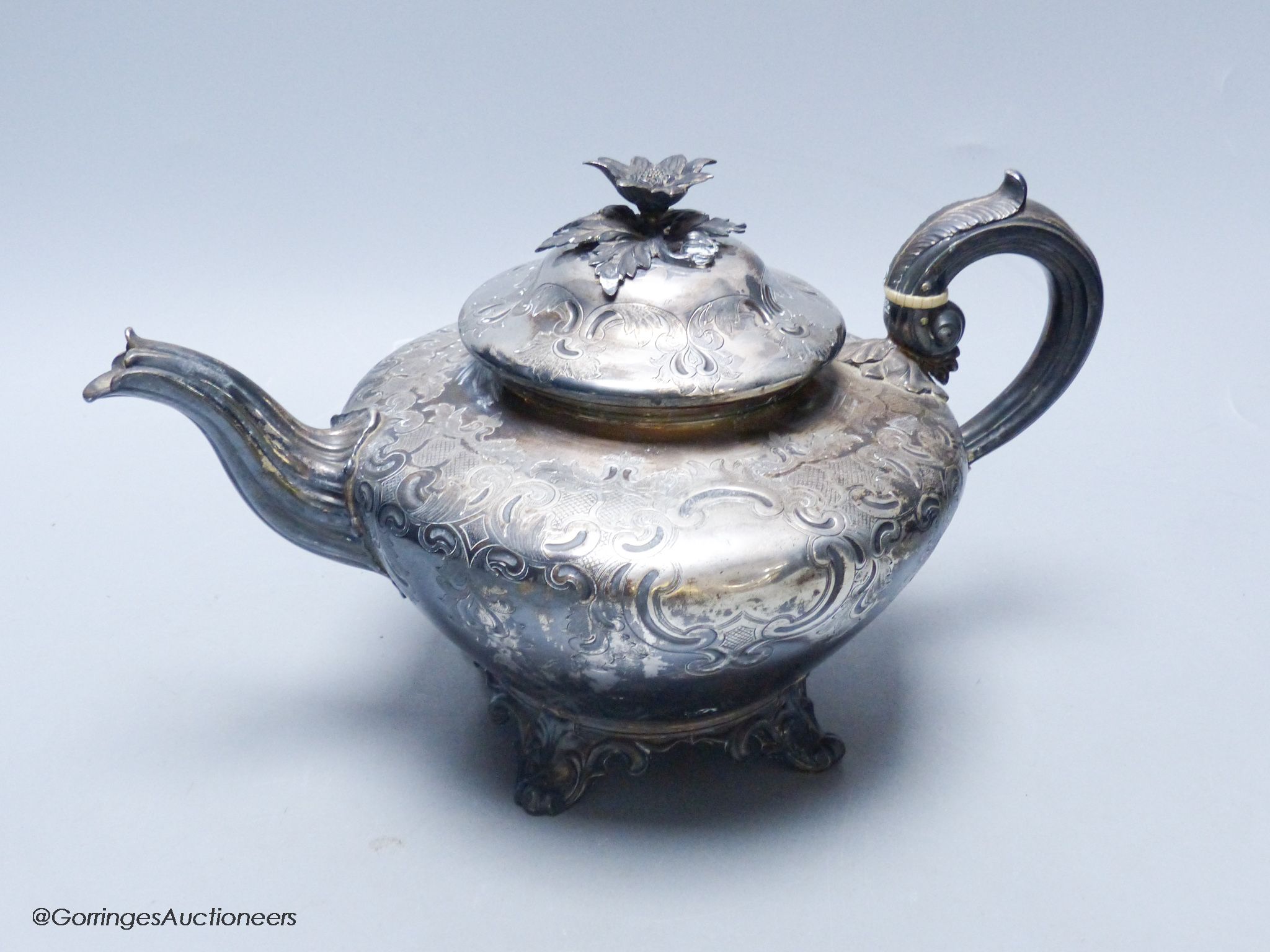 A late William IV embossed silver squat melon shaped teapot, by The Barnards, London, 1837, gross weight 24oz.